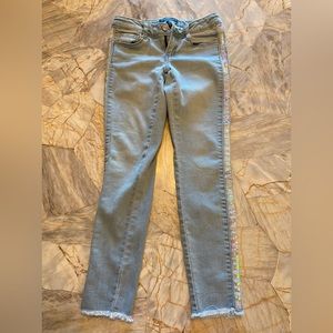 Girls light denim size 7. Sequins going down the sides of legs. Never worn